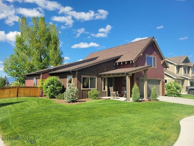 3493 Lolo Way, Bozeman, MT 59718 - back of property with an attached garage, concrete driveway, a shingled roof, and board and batten siding