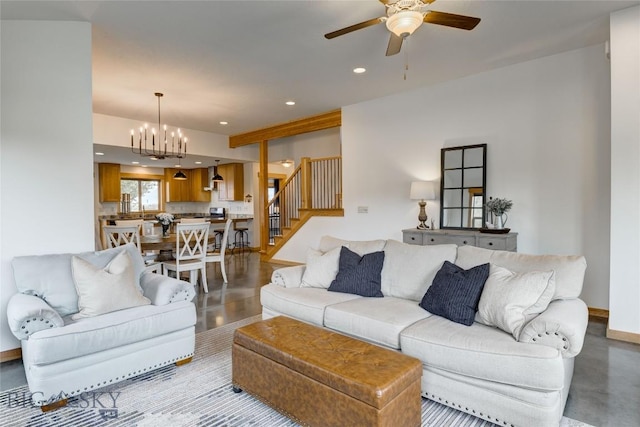 3493 Lolo Way, Bozeman, MT 59718 - living room with recessed lighting, a ceiling fan, finished concrete flooring, stairway, and a chandelier