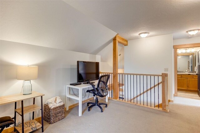 3493 Lolo Way, Bozeman, MT 59718 - office with light carpet, vaulted ceiling, and a textured ceiling
