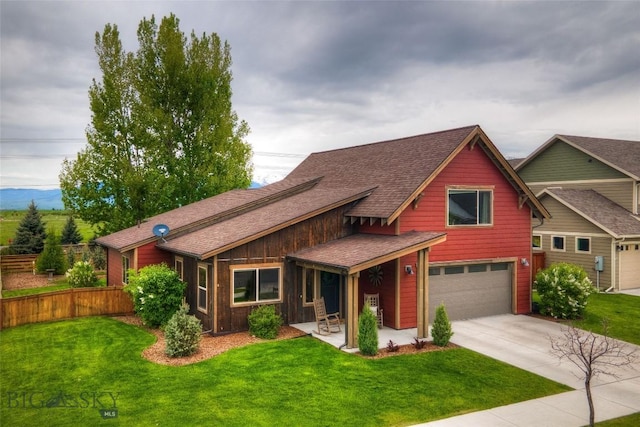 3493 Lolo Way, Bozeman, MT 59718 - view of front of home featuring a front lawn, an attached garage, driveway, and a shingled roof