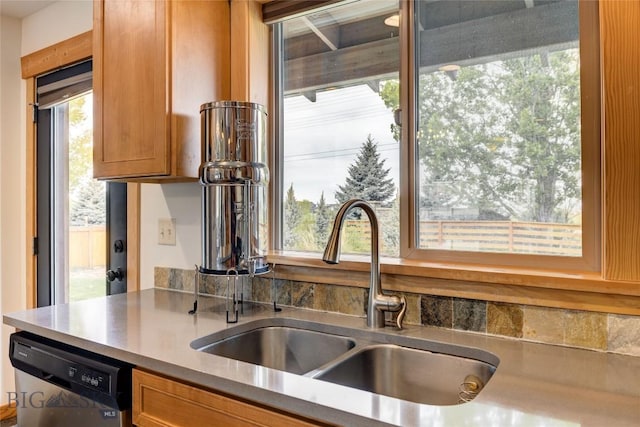 3493 Lolo Way, Bozeman, MT 59718 - kitchen featuring a sink, dishwasher, and brown cabinets