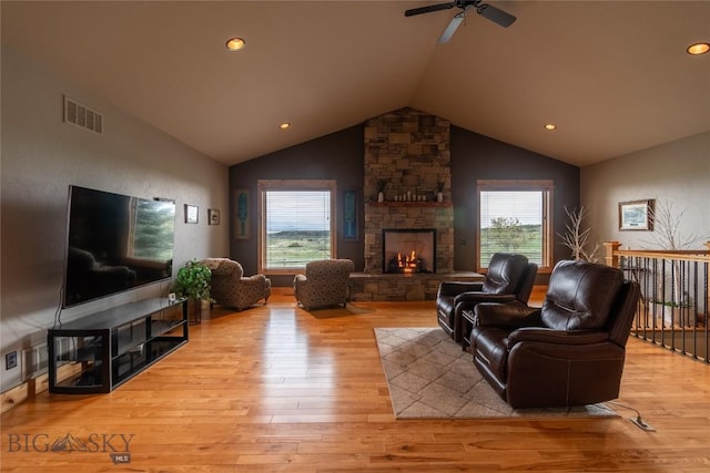 115AND117 Otter Creek Rd, Big Timber, MT 59011 - living room with lofted ceiling, a stone fireplace, wood finished floors, ceiling fan, and recessed lighting