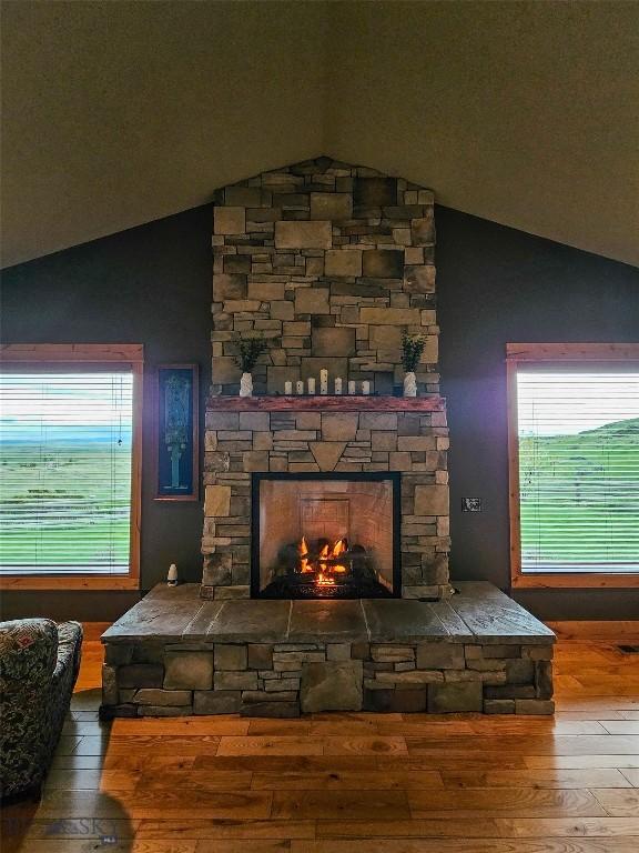 115AND117 Otter Creek Rd, Big Timber, MT 59011 - detailed view of wood finished floors and a stone fireplace