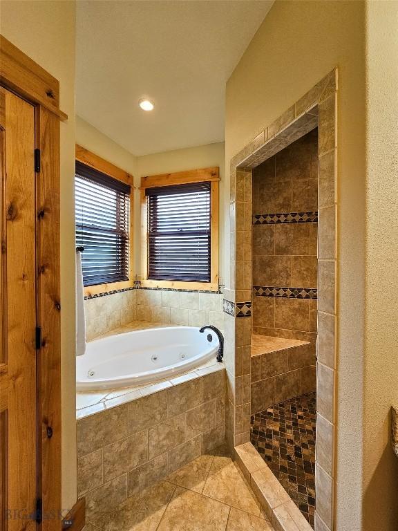 115AND117 Otter Creek Rd, Big Timber, MT 59011 - bathroom with a whirlpool tub, tile patterned floors, and a tile shower