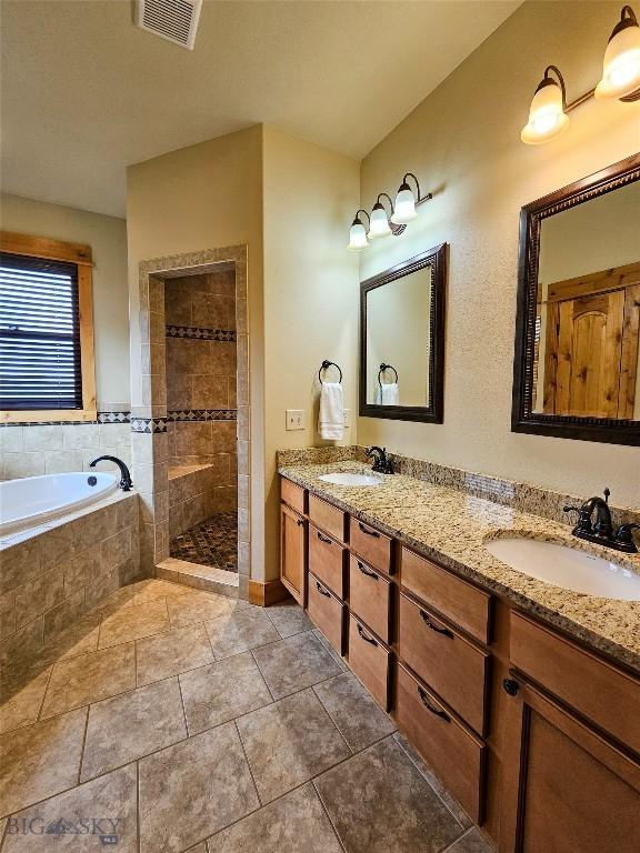 115AND117 Otter Creek Rd, Big Timber, MT 59011 - bathroom with double vanity, a bath, and a tile shower