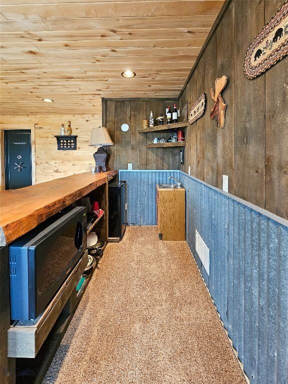 115AND117 Otter Creek Rd, Big Timber, MT 59011 - bar with wooden ceiling, wooden walls, and carpet flooring