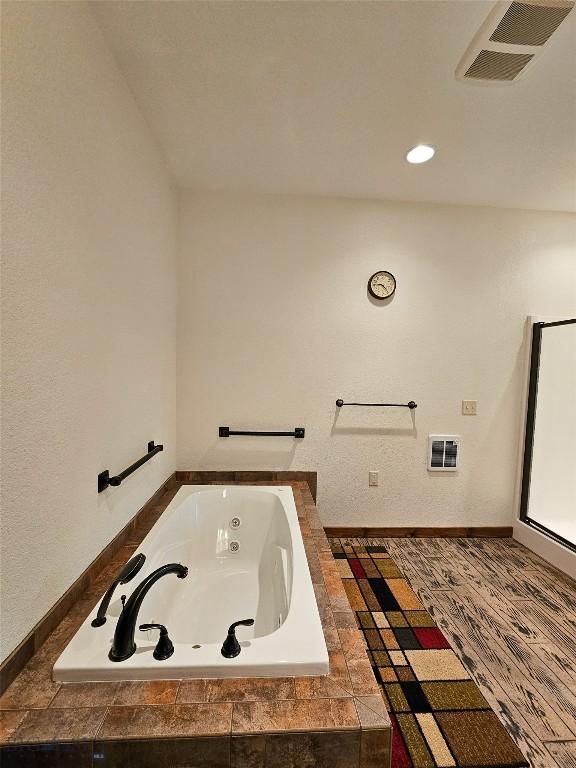 115AND117 Otter Creek Rd, Big Timber, MT 59011 - full bathroom with a tub with jets, heating unit, and recessed lighting