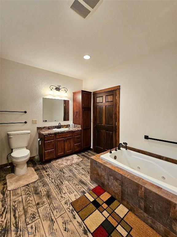 115AND117 Otter Creek Rd, Big Timber, MT 59011 - bathroom with a whirlpool tub, toilet, and vanity