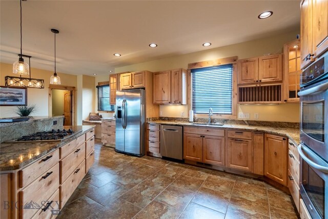 115AND117 Otter Creek Rd, Big Timber, MT 59011 - kitchen featuring appliances with stainless steel finishes, light brown cabinets, a sink, recessed lighting, and dark stone countertops