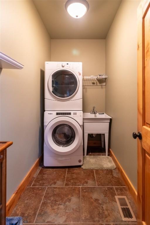 115AND117 Otter Creek Rd, Big Timber, MT 59011 - washroom with stacked washing machine and dryer and baseboards