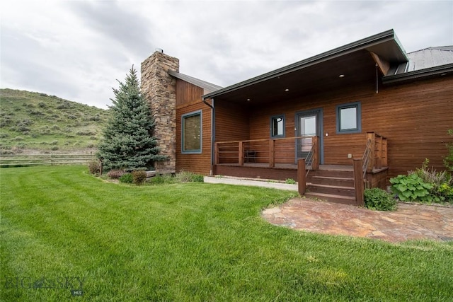 115AND117 Otter Creek Rd, Big Timber, MT 59011 - back of house featuring a lawn and a chimney