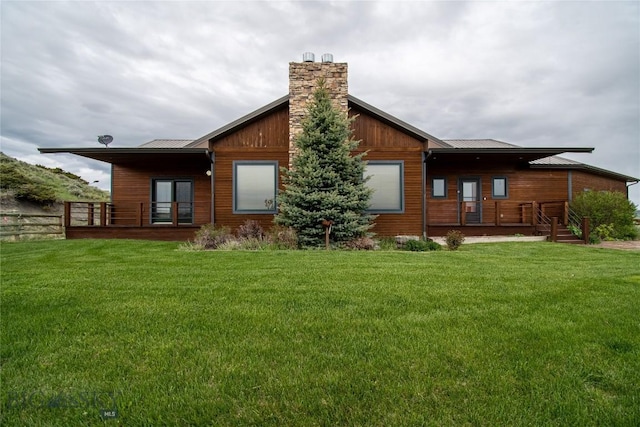 115AND117 Otter Creek Rd, Big Timber, MT 59011 - rear view of property with a chimney, metal roof, and a standing seam roof