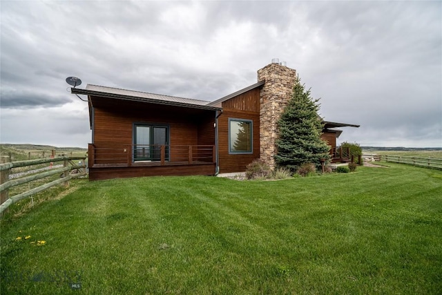 115AND117 Otter Creek Rd, Big Timber, MT 59011 - rear view of house featuring a chimney and metal roof