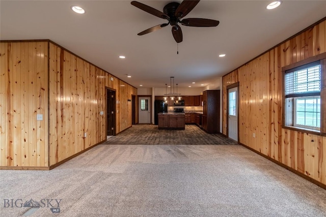 115AND117 Otter Creek Rd, Big Timber, MT 59011 - kitchen with wooden walls, dark carpet, a ceiling fan, recessed lighting, and freestanding refrigerator