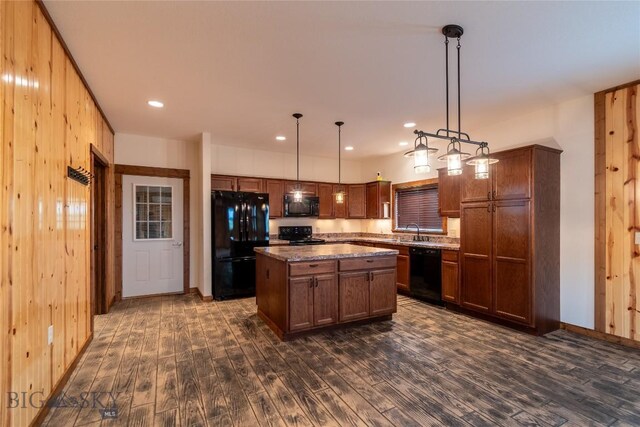 115AND117 Otter Creek Rd, Big Timber, MT 59011 - kitchen with black appliances, dark wood-style floors, wood walls, a sink, and a center island