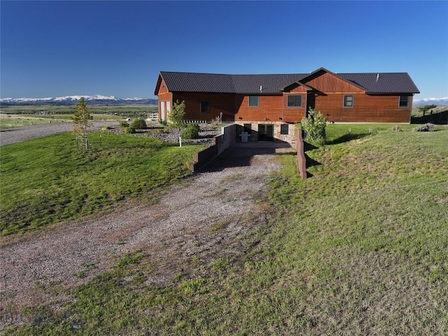 115AND117 Otter Creek Rd, Big Timber, MT 59011 - rear view of house featuring metal roof and a lawn