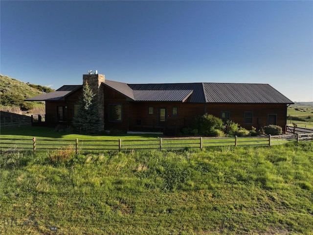 115AND117 Otter Creek Rd, Big Timber, MT 59011 - view of front of house featuring a chimney and metal roof