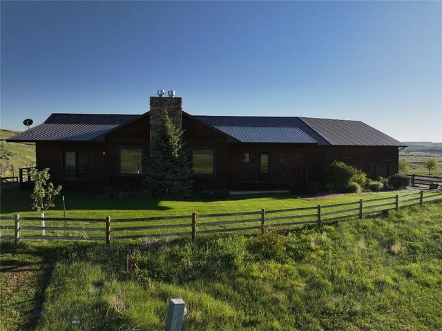 115AND117 Otter Creek Rd, Big Timber, MT 59011 - view of side of property with a chimney and metal roof