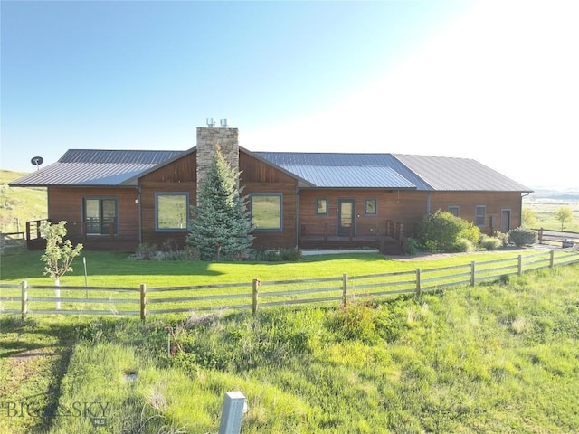 115AND117 Otter Creek Rd, Big Timber, MT 59011 - back of house with a chimney and metal roof