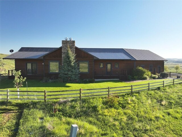 115AND117 Otter Creek Rd, Big Timber, MT 59011 - back of property featuring a chimney and metal roof