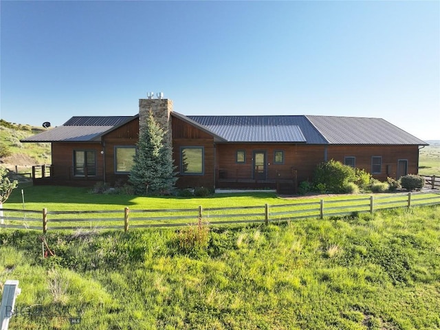 115AND117 Otter Creek Rd, Big Timber, MT 59011 - view of front facade with a chimney and metal roof