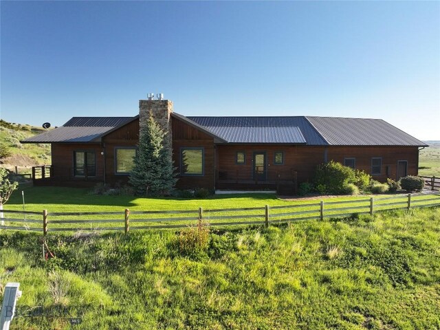 115AND117 Otter Creek Rd, Big Timber, MT 59011 - view of front of home with a chimney and metal roof