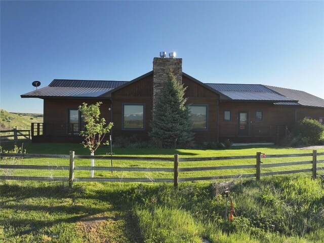 115AND117 Otter Creek Rd, Big Timber, MT 59011 - view of front of home with a chimney and metal roof