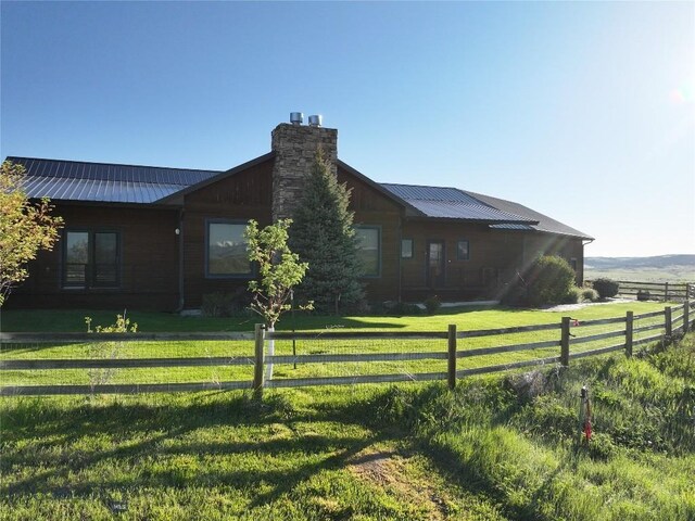 115AND117 Otter Creek Rd, Big Timber, MT 59011 - view of side of property with a chimney and metal roof
