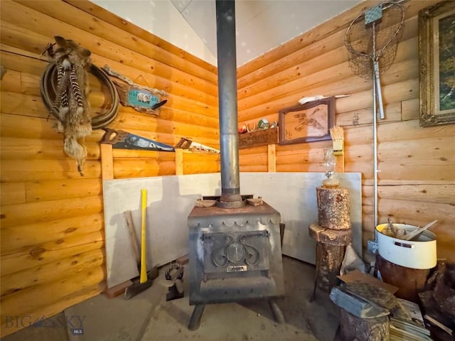 222 S Fork Ray Creek Rd, Townsend, MT 59644 - detailed view of concrete flooring, a wood stove, and log walls