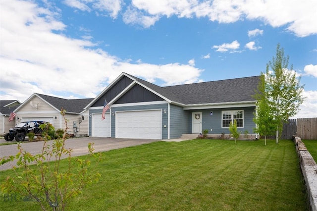 2206 Sturnella Ln, Belgrade, MT 59714 - view of front facade with board and batten siding, an attached garage, and driveway