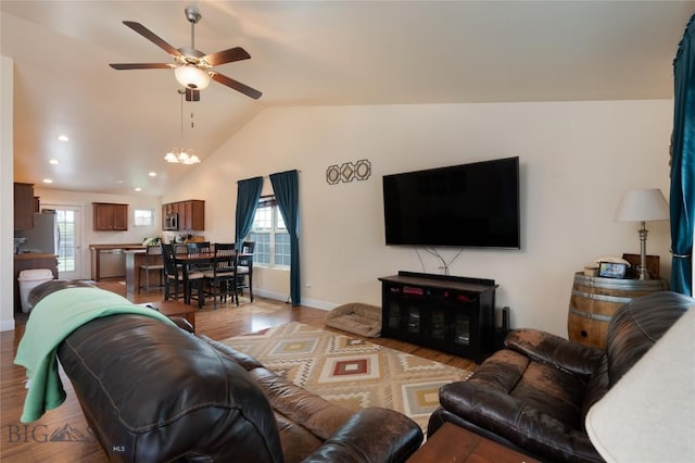 2206 Sturnella Ln, Belgrade, MT 59714 - living area featuring light wood-style flooring, ceiling fan, healthy amount of natural light, lofted ceiling, and baseboards