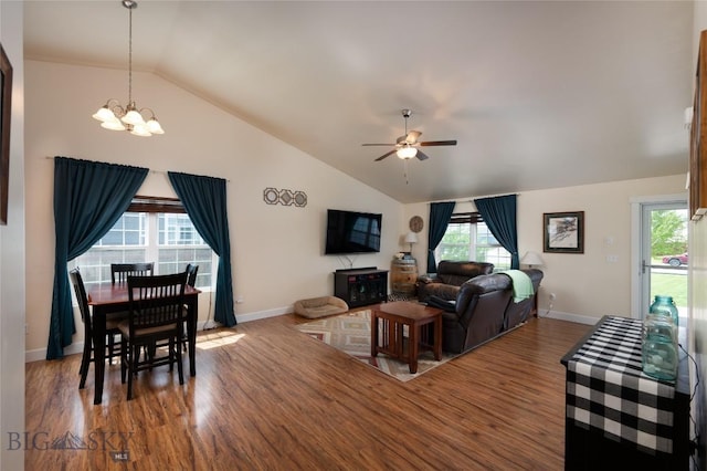 2206 Sturnella Ln, Belgrade, MT 59714 - living area featuring lofted ceiling, a chandelier, wood finished floors, ceiling fan, and healthy amount of natural light