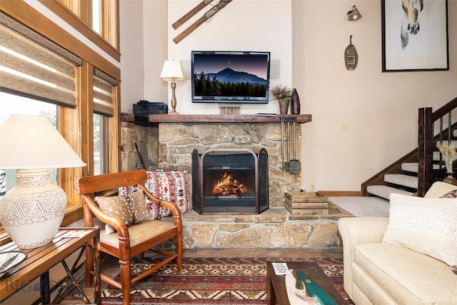 75 Rose Hip Cir, Big Sky, MT 59716 - living area featuring stairs, a fireplace, baseboards, and wood finished floors