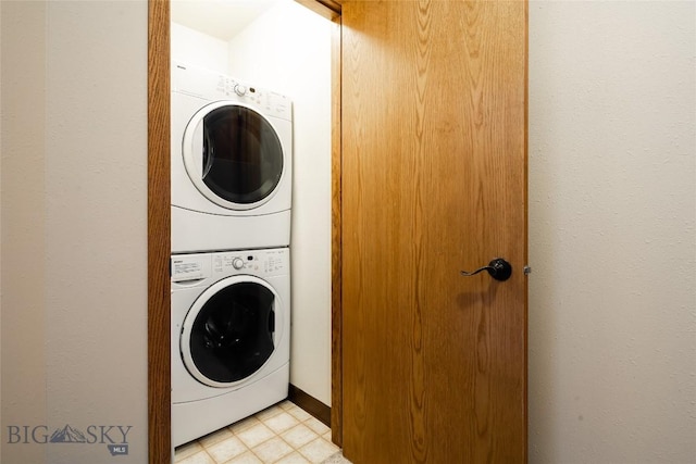 75 Rose Hip Cir, Big Sky, MT 59716 - laundry room featuring stacked washing machine and dryer and light tile patterned floors