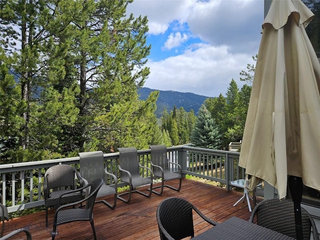 75 Rose Hip Cir, Big Sky, MT 59716 - wooden terrace featuring a mountain view