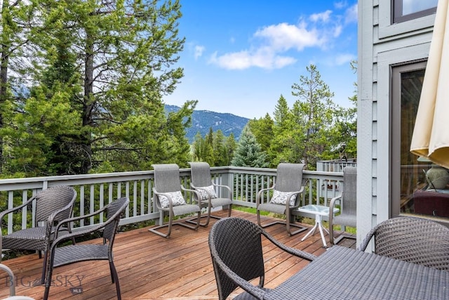 75 Rose Hip Cir, Big Sky, MT 59716 - wooden deck with a mountain view