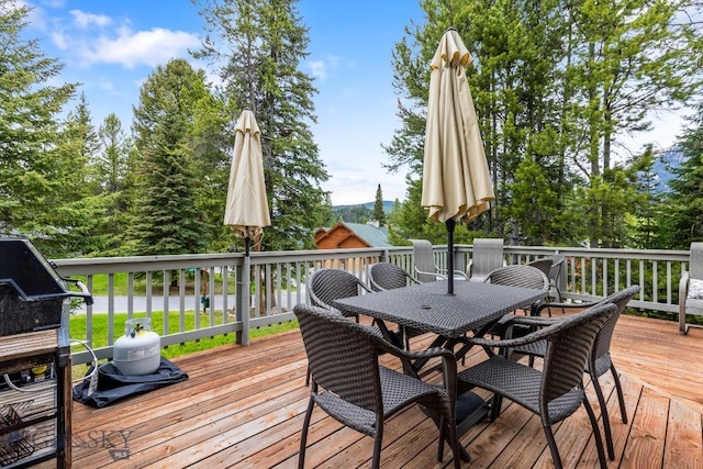 75 Rose Hip Cir, Big Sky, MT 59716 - deck featuring outdoor dining space and area for grilling