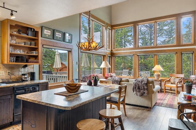75 Rose Hip Cir, Big Sky, MT 59716 - kitchen featuring dishwasher, plenty of natural light, rail lighting, and a high ceiling