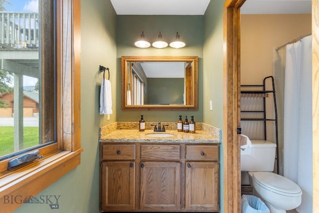 75 Rose Hip Cir, Big Sky, MT 59716 - bathroom featuring healthy amount of natural light, vanity, and a shower with curtain