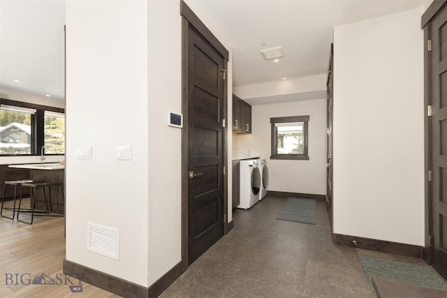 453 Outlook Trl, Big Sky, MT 59716 - laundry area with cabinet space, washer and dryer, plenty of natural light, baseboards, and recessed lighting