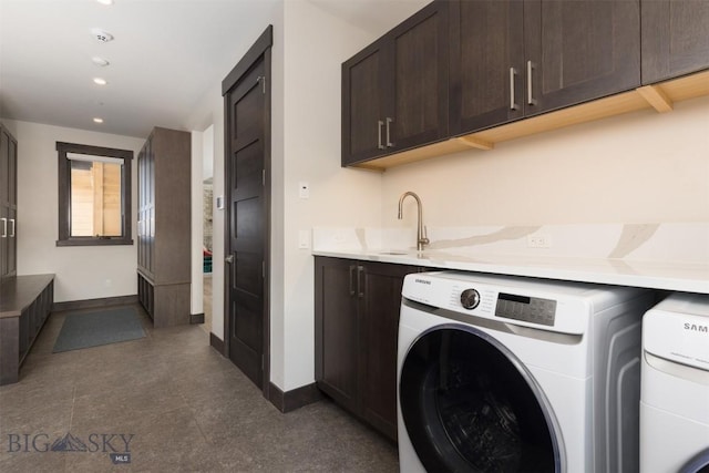453 Outlook Trl, Big Sky, MT 59716 - washroom featuring cabinet space, baseboards, recessed lighting, and washer and clothes dryer