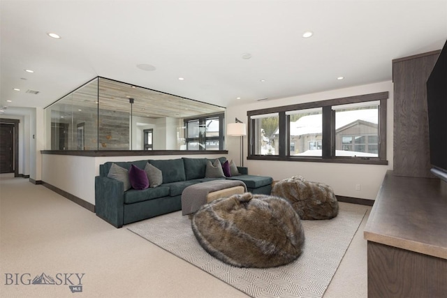 453 Outlook Trl, Big Sky, MT 59716 - carpeted living area featuring healthy amount of natural light, baseboards, and recessed lighting