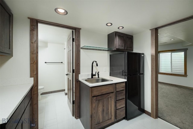 20 Prairie Grass B, Bozeman, MT 59718 - kitchen with freestanding refrigerator, dark brown cabinetry, light countertops, and recessed lighting