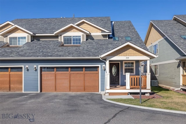 20 Prairie Grass B, Bozeman, MT 59718 - view of front of home with driveway, a porch, and roof with shingles