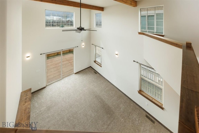 20 Prairie Grass B, Bozeman, MT 59718 - empty room featuring carpet, a high ceiling, a ceiling fan, and beam ceiling