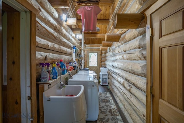 3 Dolly Varden Dr, Mcallister, MT 59740 - laundry room with rustic walls, washing machine and dryer, and wood finished floors