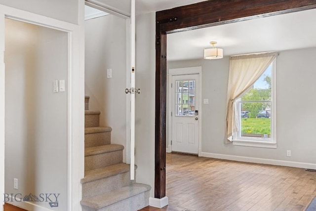 209 N 3rd, Bozeman, MT 59715 - entryway featuring wood-type flooring, stairway, and baseboards