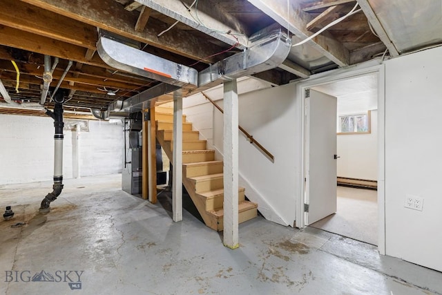 209 N 3rd, Bozeman, MT 59715 - below grade area with stairway and a baseboard heating unit