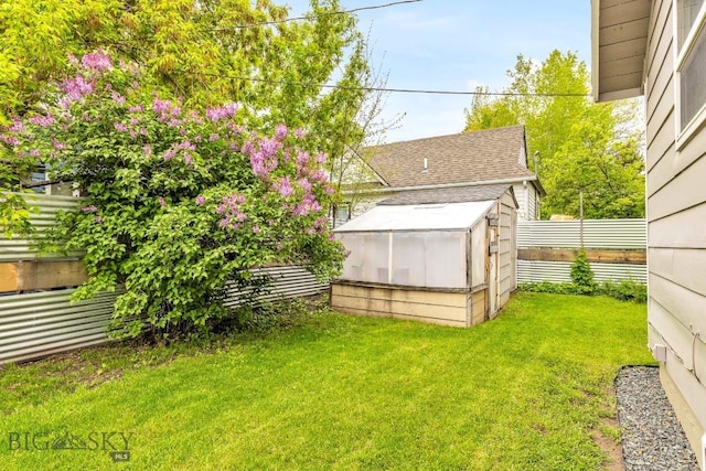 209 N 3rd, Bozeman, MT 59715 - view of yard with a greenhouse and an outbuilding