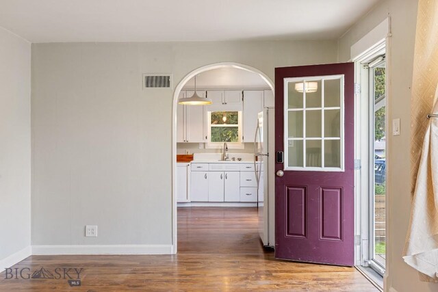 209 N 3rd, Bozeman, MT 59715 - entryway featuring plenty of natural light, wood finished floors, and baseboards